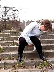 15 pictures - City pissing for cute short haired babe