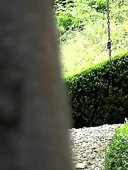 15 pictures - Toned brunette takes off her shorts to piss outside