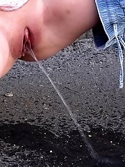 15 pictures - Gorgeous blonde is filmed peeing in public