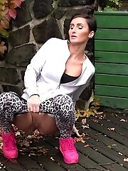 15 pictures - Dark haired babe squats to piss outside