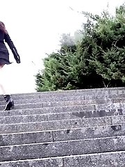 15 pictures - Dark haired hottie pisses down concrete steps