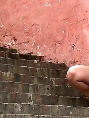 15 pictures - Curvy chick pees onto the concrete steps