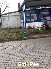 15 pictures - Redhead babe pisses in the middle of the city