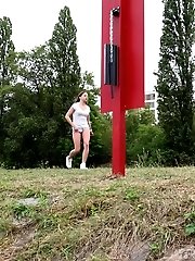 15 pictures - Brunette pisses outside on some steps