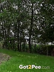 15 pictures - Dark haired exotic babe squatting to pee outside