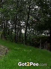 15 pictures - Dark haired exotic babe squatting to pee outside