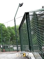15 pictures - Pretty brunette pisses near tennis courts