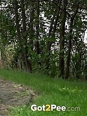 15 pictures - Dark haired exotic babe squatting to pee outside