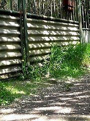 15 pictures - Blonde with tattoos pisses on an outdoor path