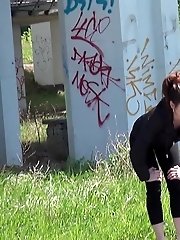 15 pictures - Pretty brunette pisses next to a parked van