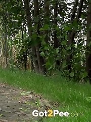 15 pictures - Dark haired exotic babe squatting to pee outside