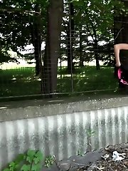 15 pictures - Sexy dark haired babe pisses outside
