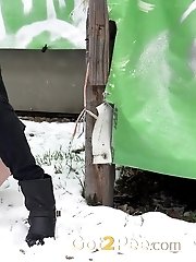 15 pictures - Pretty dark haired girl melts snow as she pees