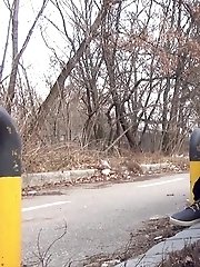 15 pictures - Brunette girl squats near a car to piss outside