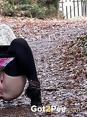 15 pictures - Playful babe nearly wets her panties outside