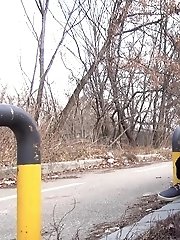 15 pictures - Brunette girl squats near a car to piss outside