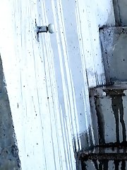 15 pictures - Beautiful raven haired girl sprays her golden pee