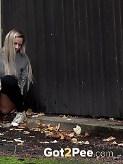 15 pictures - Pretty blonde squats to piss outside in the city