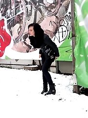 15 pictures - Pretty dark haired girl melts snow as she pees