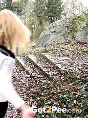 15 pictures - Playful babe nearly wets her panties outside