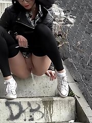 15 pictures - Pretty dark haired girl in glasses pees outside