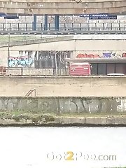 15 pictures - Redhead babe pulls down her denims to piss