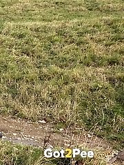 15 pictures - Dark haired babe pisses in the countryside