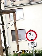 15 pictures - Sexy girl in glasses pisses in a car park space