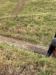 15 pictures - Dark haired babe pisses in the countryside