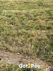 15 pictures - Dark haired babe pisses in the countryside