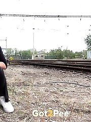 15 pictures - Next to a train line this hottie pisses