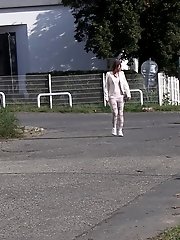 15 pictures - Brunette girl makes a pissy puddle on the road