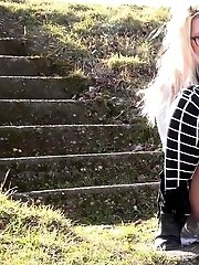 15 pictures - Cute blonde in glasses squats to piss outside