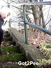 15 pictures - Hot blonde has a warm piss outside on steps