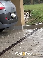 15 pictures - Sexy girl in glasses pisses in a car park space