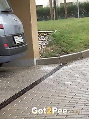 15 pictures - Sexy girl in glasses pisses in a car park space