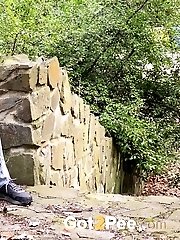 15 pictures - brunette babe relieves herself while outdoors