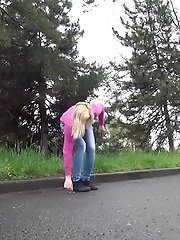 15 pictures - Blonde squats to piss next to a parked car