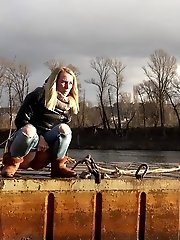 15 pictures - Pretty blonde squatting to pee by the river