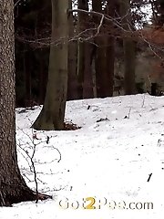 15 pictures - Hot brunette nearly pisses herself in the snow