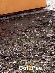 15 pictures - Brunette really needs to piss while outside