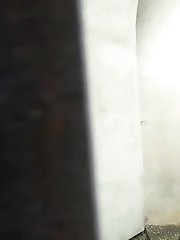 15 pictures - Toned brunette takes off her shorts to piss outside