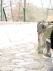 15 pictures - Blonde babe squats and pisses outside near a well