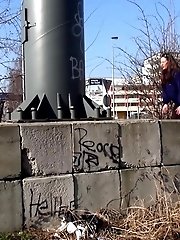 15 pictures - Brunette with long hair pisses in public view
