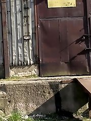 15 pictures - Gorgeous brunette filmed twice pissing outside