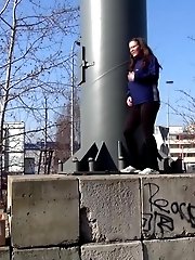 15 pictures - Brunette with long hair pisses in public view