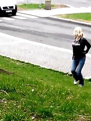 15 pictures - Pretty blonde pisses in public outside buildings