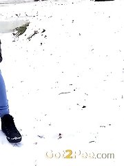 15 pictures - Sexy lady relieves herself on a snow