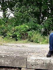 15 pictures - Sexy brunette pisses over the train tracks