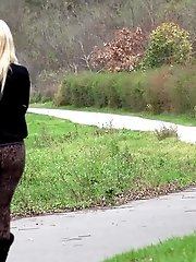 15 pictures - Pretty blonde shows her pussy as she pees